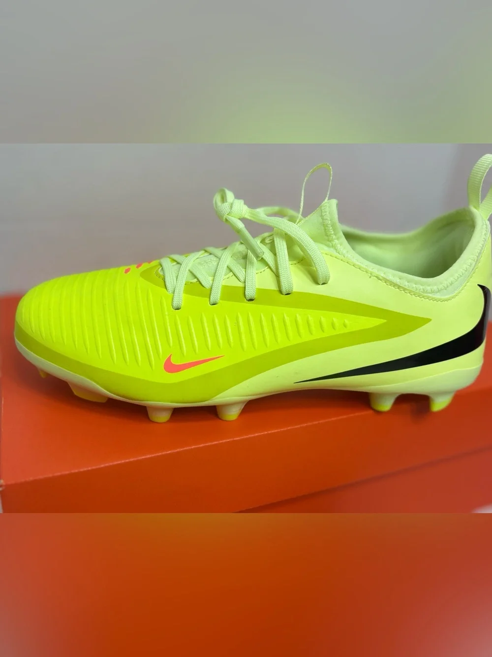 Nike Neon Yellow Soccer Cleats with Orange and Black Accents